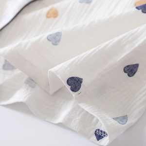 Detail of soft heart-print cotton double gauze fabric with clean stitching on hemline