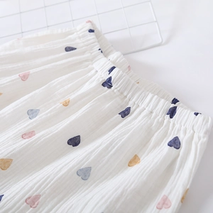 Close-up of elastic waist on white cotton pajama shorts with colorful heart prints