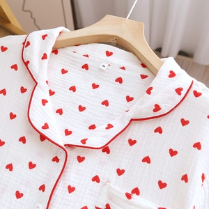 Close-up of M-size cotton gauze pajama top with red heart prints and piping detail