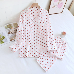 Detail of white cotton heart print pajama set with lapel collar and soft texture