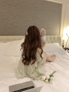 Detail of cute brown bear print and ruffles on apricot striped pajama nightdress