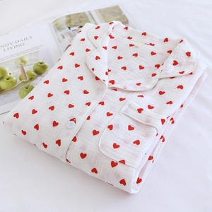 Close-up of heart print cotton pajama top with lapel collar and chest pocket detail