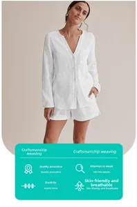 Detail of white cotton double gauze pajama set with breathable texture and v-neck button design
