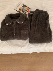 Flat lay of brown plush pajamas set with white trim details and matching long pants