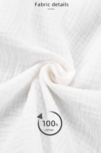 Macro view of white 100% cotton double gauze fabric texture with breathable layers