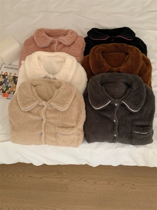 Flat lay of soft fleece pajama tops in six colors with lapel collar and pocket detail