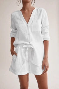 Detailed texture of white double gauze cotton pajama set with button-up shirt and shorts