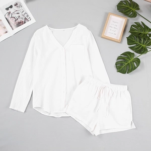 Flat lay of white double-layer gauze pajamas set with textured shirt and drawstring shorts