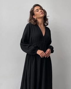 Detail view of the breathable crepe fabric texture and elegant V-neckline of the black robe