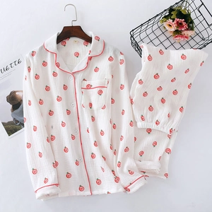 Women's white cotton pajama set with red swirl patterns and a stylish V-neck collar
