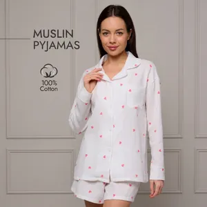 White cotton muslin pajama set for women with pink heart patterns and button-up shirt