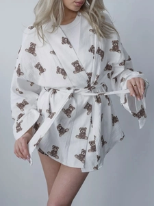 Detail showing high-quality white cotton gauze fabric with cute brown bear prints