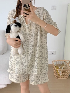 Detail of floral lace-up pajamas set with textured seersucker fabric for summer comfort