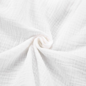 White double layer cotton gauze pajama set showing soft muslin fabric texture