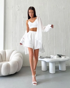 Detailed view of white three-piece leisure set featuring striped texture fabric and shorts