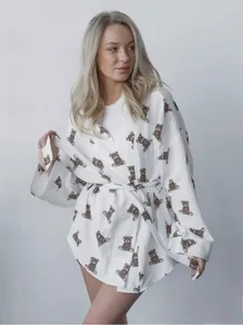 Detail view of white 100% muslin cotton loungewear with cute brown bear prints