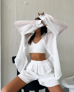 Detail of white striped texture fabric on long-sleeve cardigan and matching shorts
