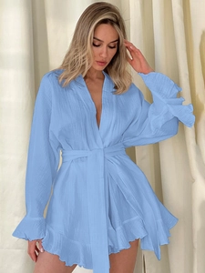 Detail of sky blue cotton crepe loungewear set featuring ruffled hem and waist tie