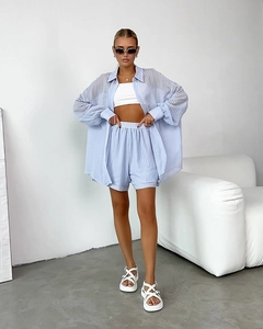 Relaxed fit light blue striped two-piece set featuring a button-down shirt and matching shorts
