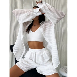 Three-piece summer set with white striped shirt, tank top, and high-waist shorts