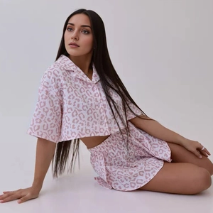 Close-up of pink leopard print short pajama set with button-down top and notched collar