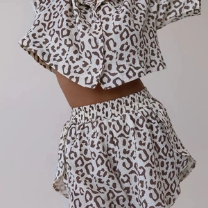 Close-up of leopard print short pajama set with waffle texture and front buttons