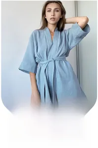 Close-up of soft light blue cotton crepe texture on a breathable women bathrobe