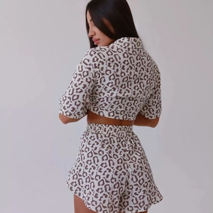 Back view of leopard print two-piece lounge set with short sleeve shirt and high waist shorts