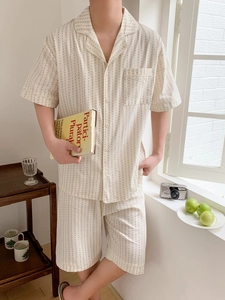 Men's minimalist off-white pajama set featuring subtle vertical striped dot patterns