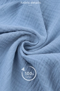 Detail view of breathable 100% cotton crepe fabric showing soft texture and weaving