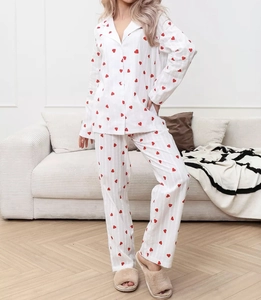 Detail of white cotton heart-print pajama set with lapel collar and button-down front