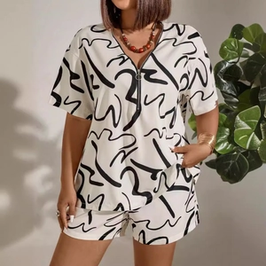 Women's two-piece short sleeve set with V-neck zipper and black abstract print