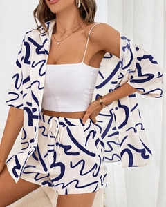 Detail of summer two-piece set featuring abstract print on lightweight woven fabric