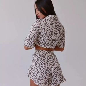 Women's summer two-piece pajama set featuring leopard print short sleeve top and shorts
