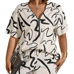Women's two-piece set with V-neck zipper top and trousers featuring abstract black lines