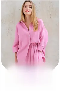 Close-up of pink long-sleeve crepe cotton pajama set with buttons and elastic shorts