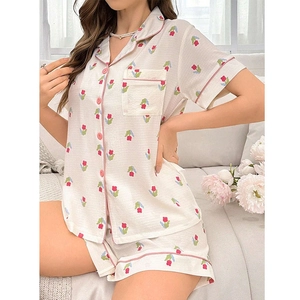 Detail of floral loungewear set featuring pink tulips on breathable cotton fabric