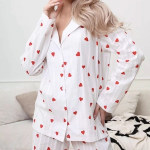 White long-sleeve pajama set with red heart prints and classic notched lapel design
