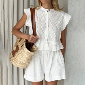 White two-piece summer set featuring eyelet embroidery short sleeve shirt and matching shorts