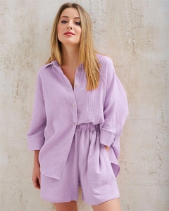 Close-up of light purple crepe cotton pajamas set with textured fabric and button detail