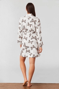 Detailed back view of a white butterfly print knit robe showing the texture and fluid drape