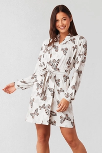 Detail of white butterfly print bathrobe featuring V-neck collar and tied waist belt