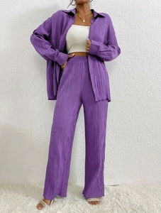 Detailed macro shot of the premium pleated texture on purple long-sleeve leisure set