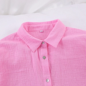 Detail of pink cotton crepe pajama shirt with buttons and M size label