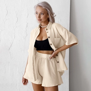 Women's beige minimalist cotton two-piece loungewear set with short sleeve shirt and shorts