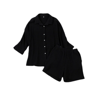 Women's black long sleeve shirt and shorts set with textured crepe fabric and white buttons