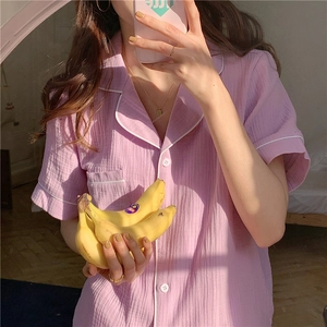 Close-up of lilac gauze cotton short-sleeve pajama top with white contrast piping details
