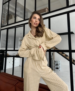 Detail of soft yellow plaid pajamas with breathable cotton fabric and loose high waist pants