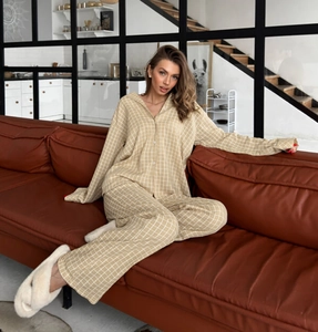 Cozy checkered pajama set for women shown in a modern living room setting