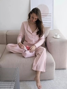 Close-up of pink ribbed knit loungewear set with soft texture and button cardigan detail